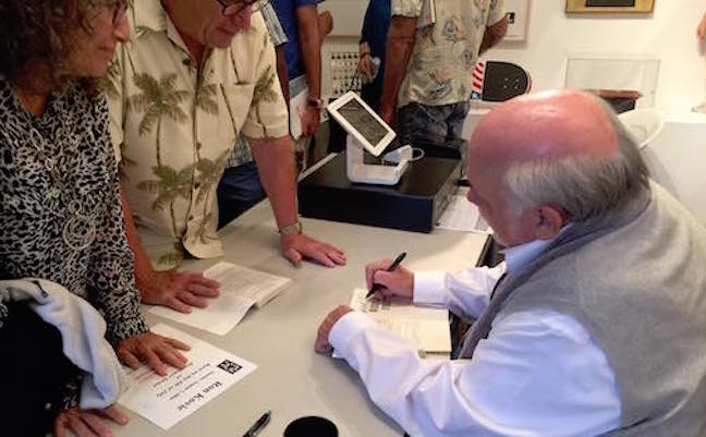 Ron Kovic signs books for an appreciative crowd at Santa Monica reading.